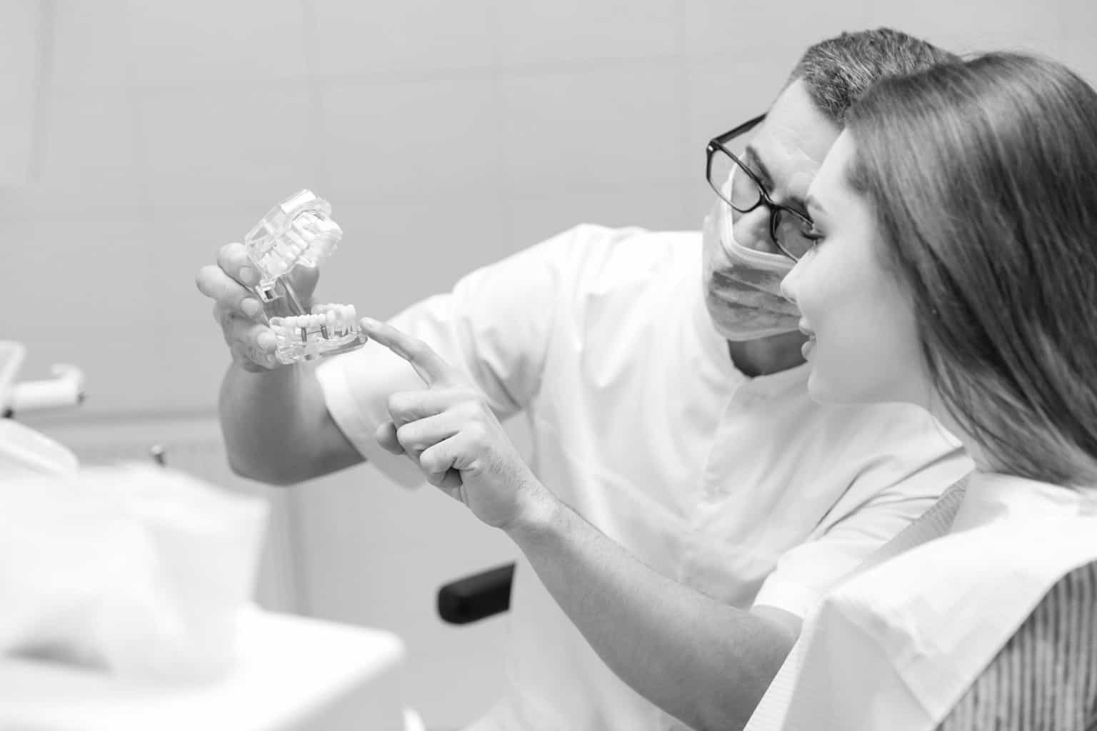 dentist showing patient